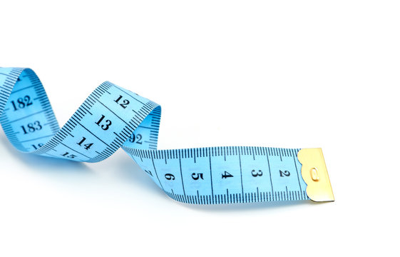 Tailors tape measure cut out against a white background. Blue