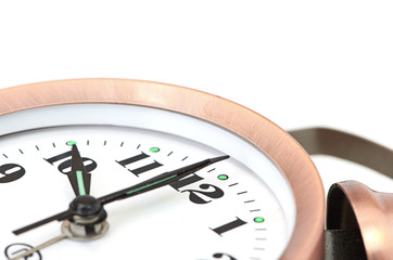 bronze vintage alarm clock isolated on white background