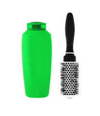 Green shampoo bottle and hairbrush isolated on white