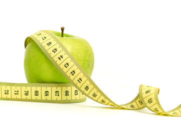 dieting. apple and tape isolated on a white background