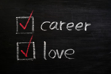 Obraz premium Love and career choices with check boxes on a blackboard