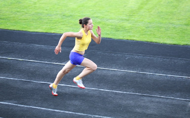 Girl running on the track