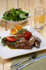 Piece of Medium Rare Steak with Spicy Herb Sauce