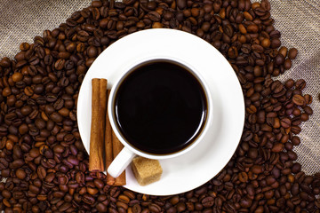 Coffee beans and white cup