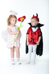 the boy in the image of devil and a girl angel