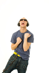 Young man singing and dancing while listening to music