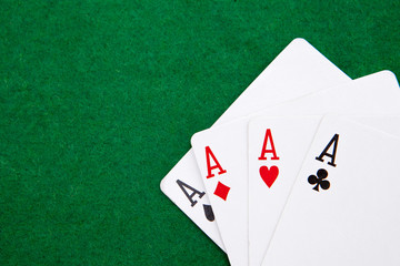 quads on a green casino table with space for text