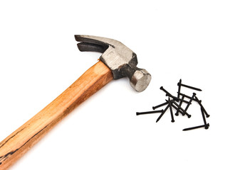 hand hammer with pile of nails over white