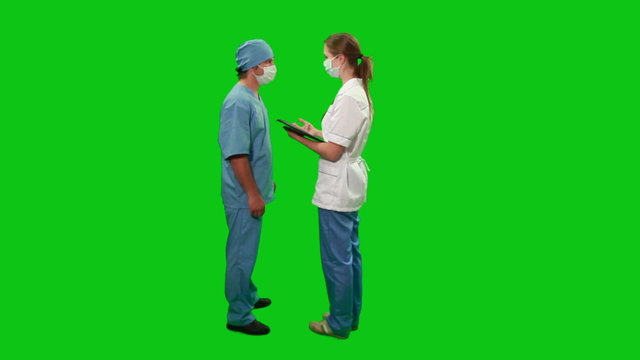 Doctors consulting, green screen.
