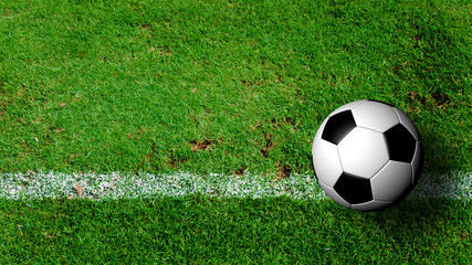 Fototapeta na wymiar Soccer Ball on green grass field from top view