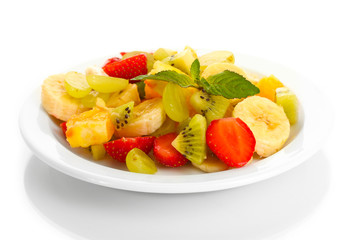 Fresh fruits salad on plate isolated on white