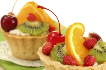 sweet cake with fruits on wooden table