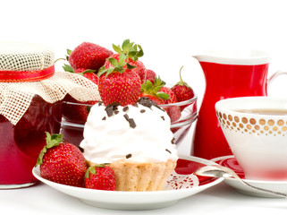 Dessert - sweet cake with strawberry and cherry on a plate