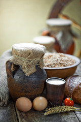 Composition of milk on the bread, the old background