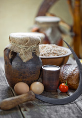 Composition of milk on the bread, the old background