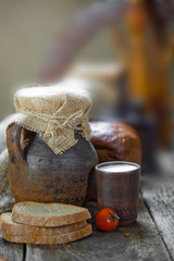 Composition of milk on the bread, the old background