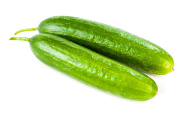 Healthy food. The green cucumbers isolated on white background