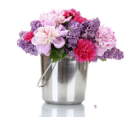 beautiful spring flowers in metal bucket isolated on white