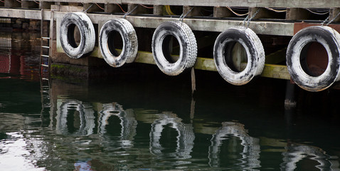 Row of old tires to protect boats