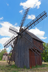 Fototapeta na wymiar old windmill on meadow