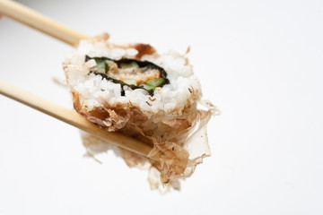 Sushi with chopsticks isolated