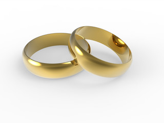 Złote i srebrne obrączki ślubne wyizolowane na białym tle