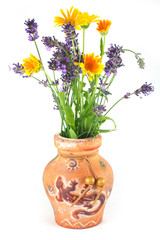 Vase with flowers of calendula and lavender