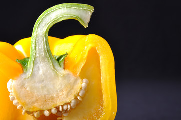 Yellow pepper isolated on black background