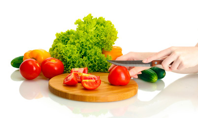 woman hands cutting vegetables on kitchen blackboard