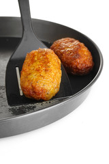 Tasty burgers in the pan on white background close-up