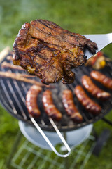 Grilling meat in flames, tasty dinner 