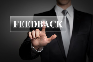 businessman pressing touchscreen button - feedback