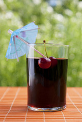 Glass of natural fresh cherry juice