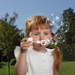 girl play in  bubbles
