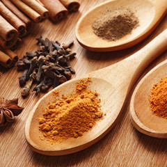 Herbs and Spices over wooden background