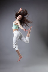 beauty girl dance on grey background