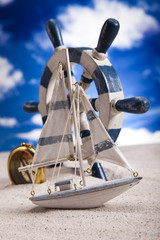 Sailboat on sand on beach Background