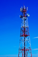 Telecommunications tower, painted white and red in a day of clea