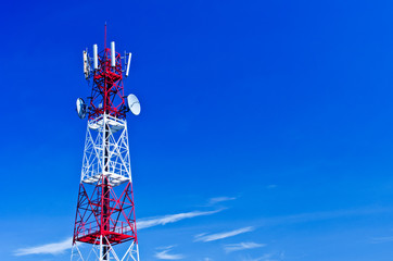 Telecommunications tower, painted white and red in a day of clea