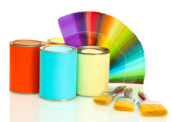 tin cans with paint, brushes and bright palette of colors