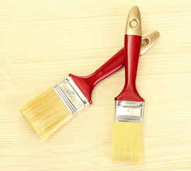 paint brushes on wooden background