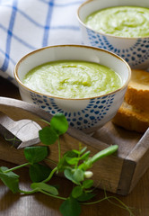Fresh green pea soup on a tray
