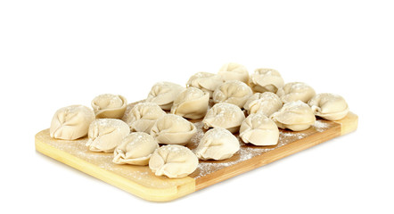 Raw Dumplings on cutting board isolated on white