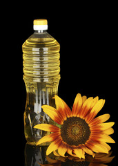 sunflower oil in a plastic bottle isolated on black background
