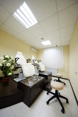 Room for pedicure with two chairs and bathtubs.