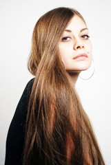 Young Woman with long Hairs