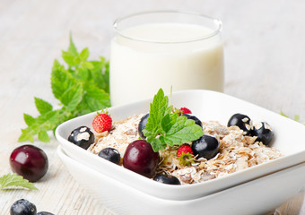 Healthy breakfast - muesli, milk and berry