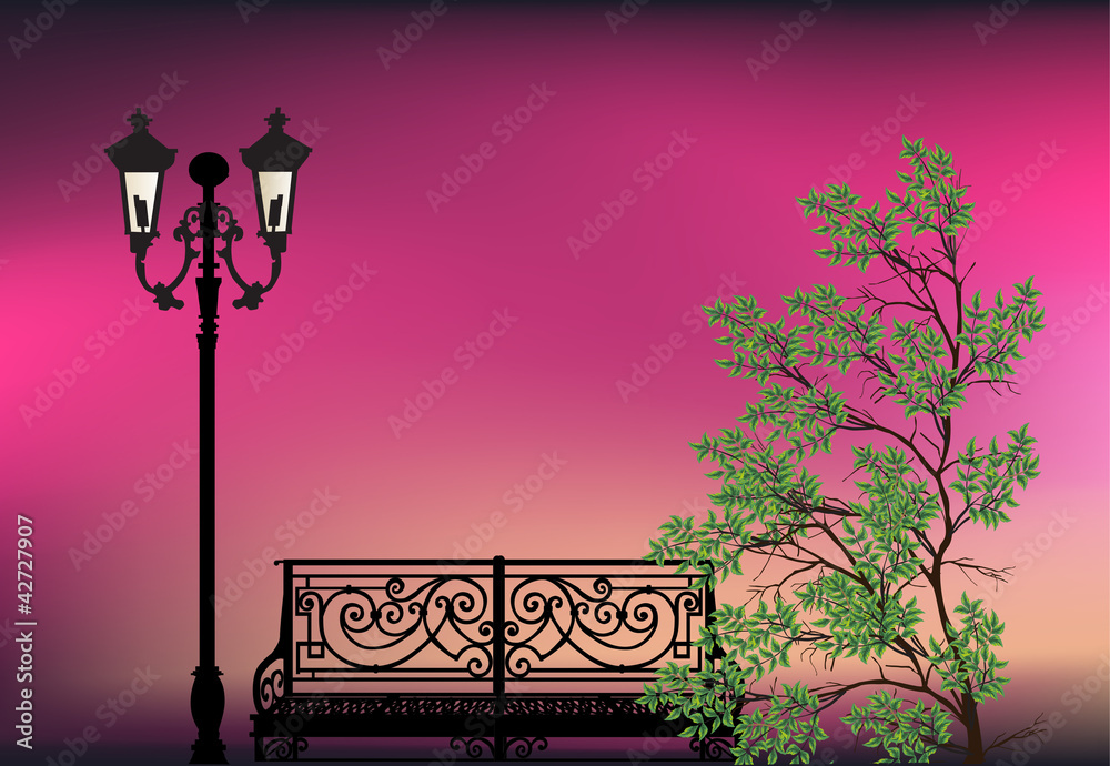 Wall mural green tree and bench at sunset