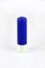Blue tube of lip balm isolated on white background