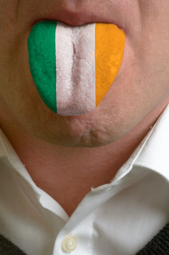 man tongue painted in ireland flag symbolizing to knowledge to s